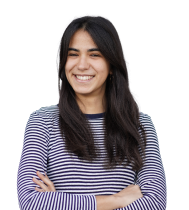 Happy young woman with dark hair, wearing a striped shirt, arms crossed.